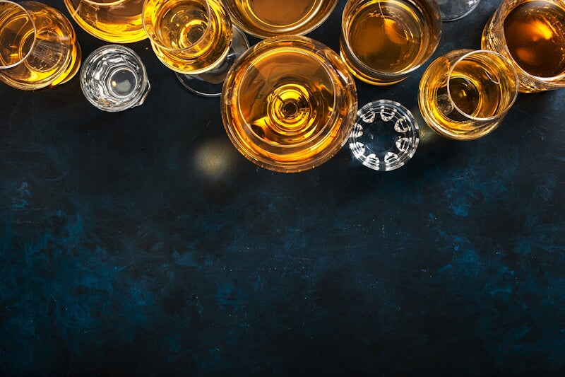 Whisky glasses on a table, featured in the About Us section of Whisky Estate